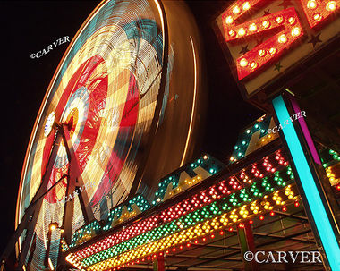 Night at the Fair
The ferris wheel turns it's bright lights while rows of color call riders to the bumper cars nearby.
A long duration exposure from the Topsfield Fair.
Keywords: Topsfield Fair; ferris wheel; color; photograph; picture; print